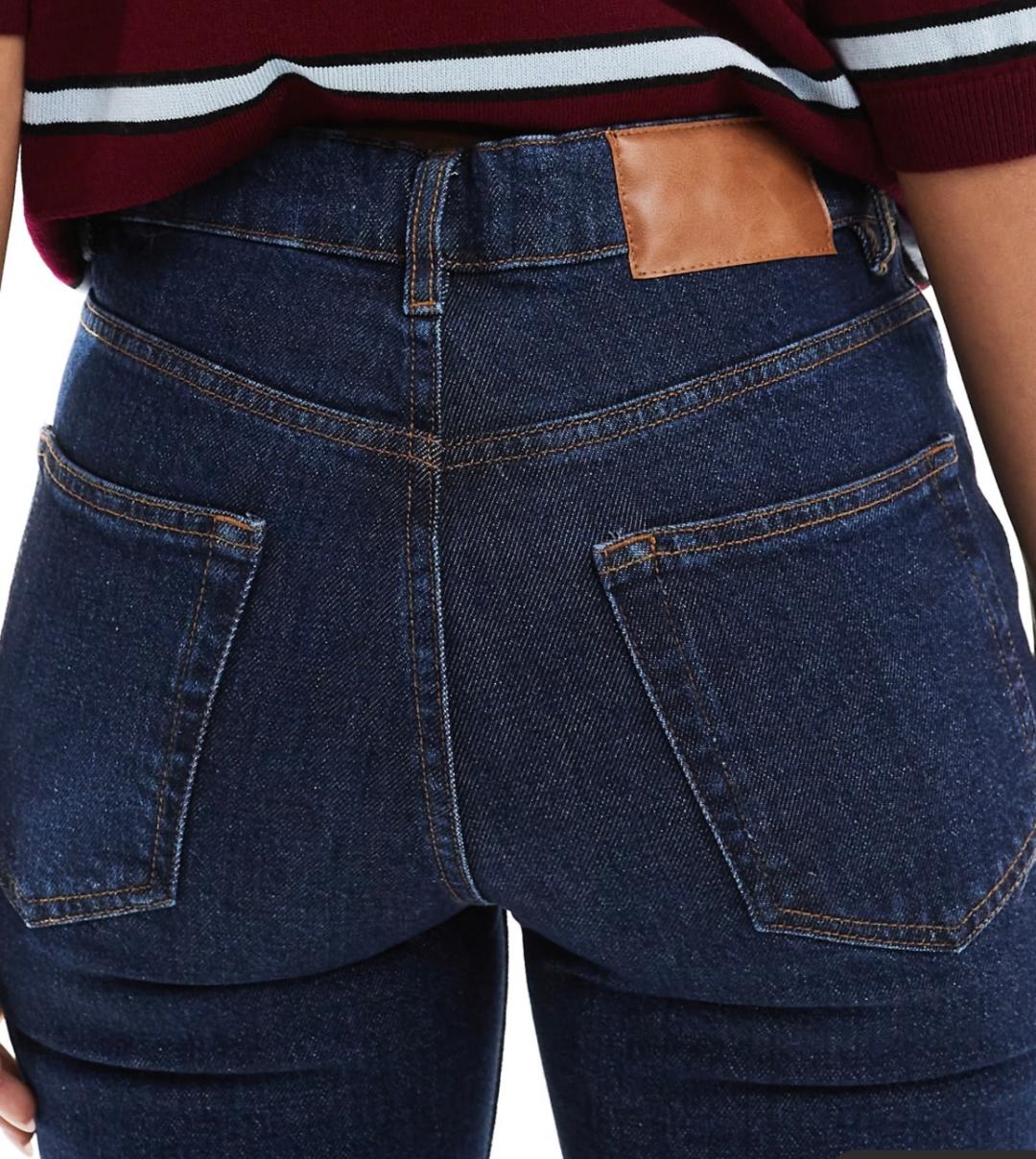 High rise slim straight jean in darkwash with brown faux leather trim
