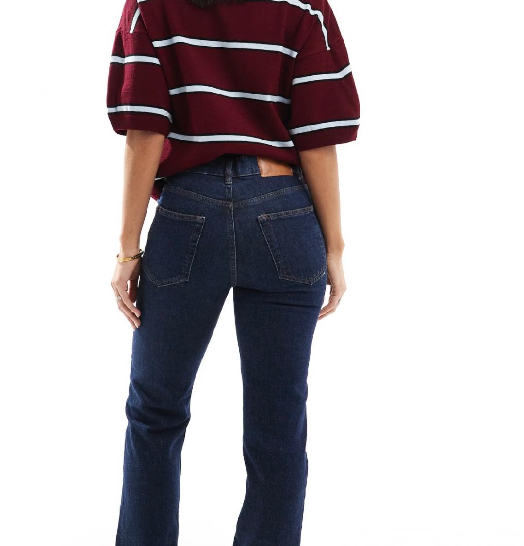 High rise slim straight jean in darkwash with brown faux leather trim